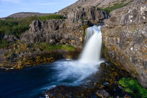 Iceland waterfall closeup view of the gods cliff with long exposure smooth motion of water in summer landscape — Stockfoto