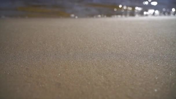 Slow-motion of Crystal clear water and gold sand — Stock Video