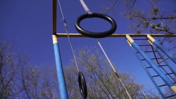 Gymnastics ring in the open air play ground in Kiev Hydropark — Stock Video