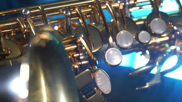 Golden shiny alto saxophone with blue smoke. Concept of grace and elegance — Stock Video