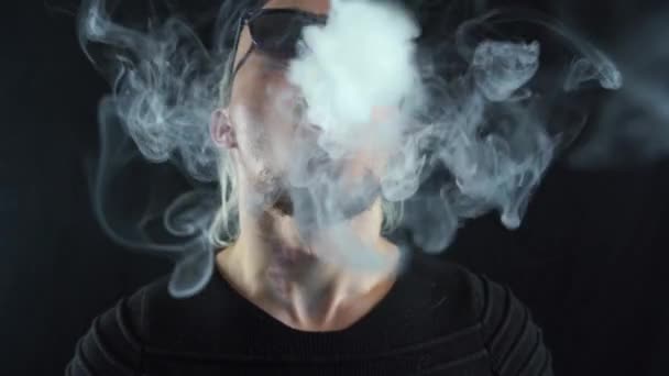 Man blowing many rings of steam and sends it to the camera with in slow motion — Stock Video