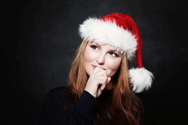 Woman in Santa Hat Looking Up and Dreaming on Christmas Gift on — Stock Photo, Image