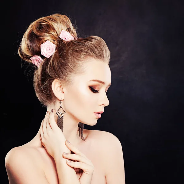 Healthy Woman with Makeup and Bridal Hairstyle with Rose Flowers