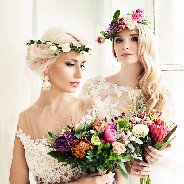 Two Beautiful Blonde Women Fiancee. Fashion Model with Flower Ar — Stock Photo, Image