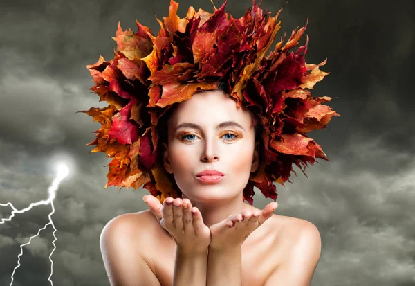 Autumn Woman Blowing Kiss on Cloudy Sky. Beautiful Fashion Model — Stock Photo, Image