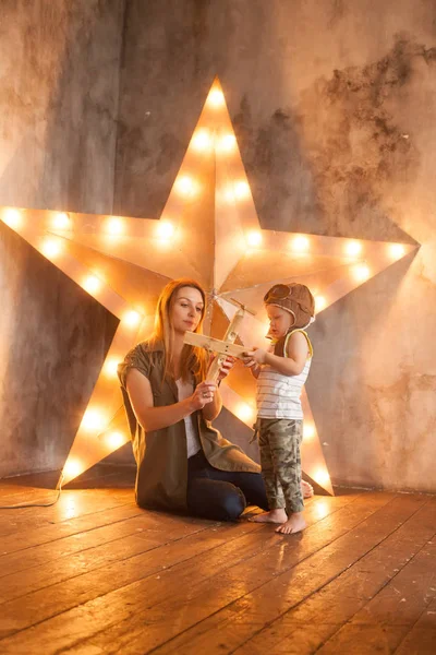 Young Mother and her Child Boy on Studio Background — Stock Photo, Image