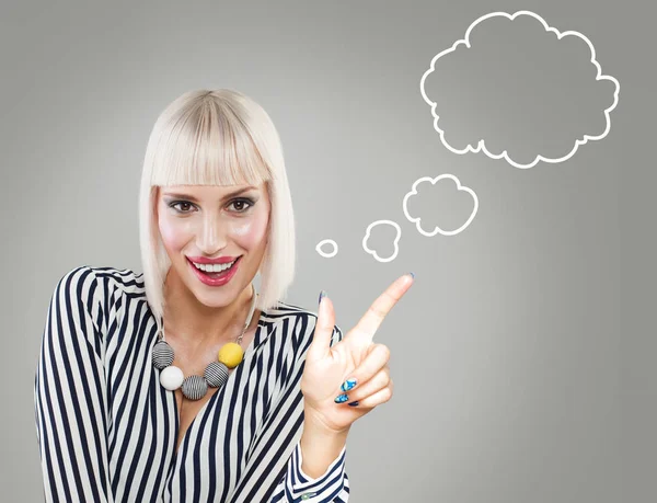 Happy woman with empty bubble on gray background — Stock Photo, Image