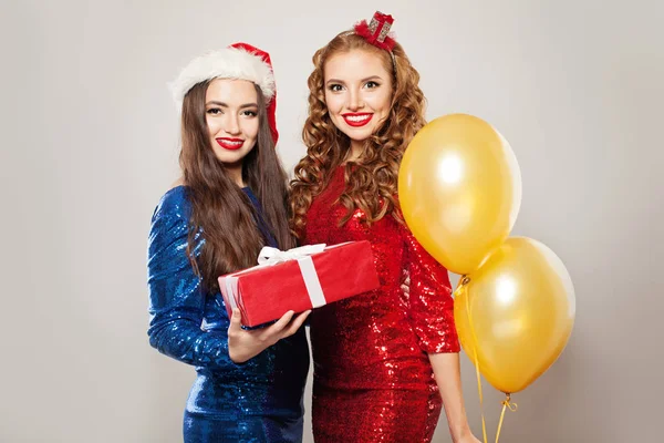 Christmas models with red gift box on white background — Stock Photo, Image