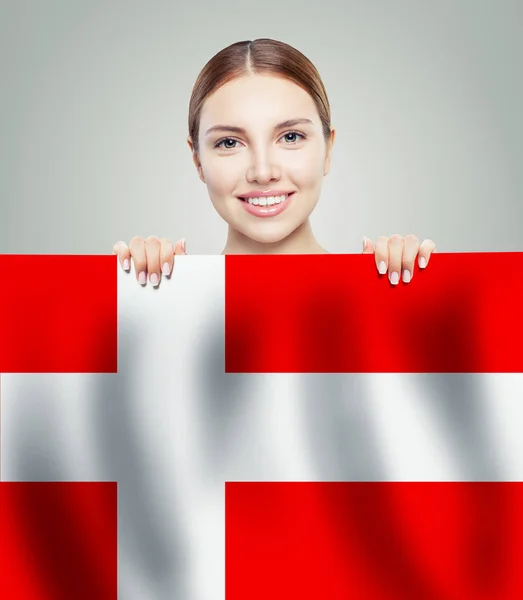 Smiling woman student showing Denmark flag background — Stock Photo, Image