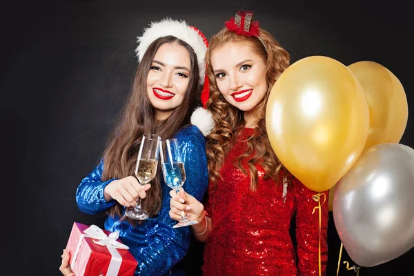 Beautiful Christmas women on black background — ストック写真