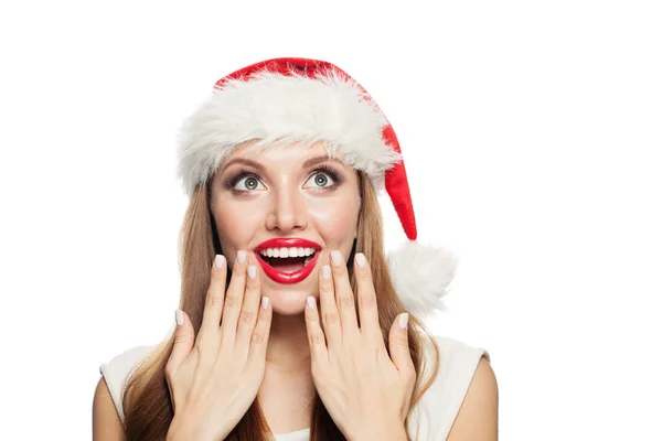 Surprised woman Santa looking up isolated on white background — Stock Photo, Image