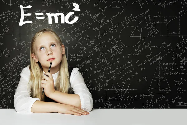 Student little girl thibking about science. Background with formula — ストック写真