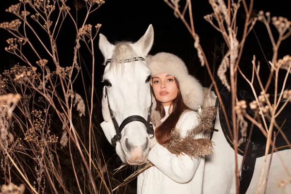 Winter portrait of fashion model woman with white horse outdoors — 스톡 사진