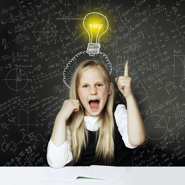 Child girl thumbs up and lightbulb. Concept Ideas and projects — Stok fotoğraf
