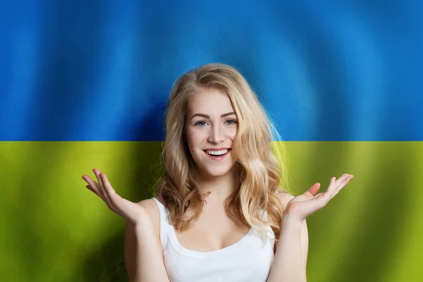 Surprised cute happy girl with Ukrainian flag background. Travel — Stockfoto