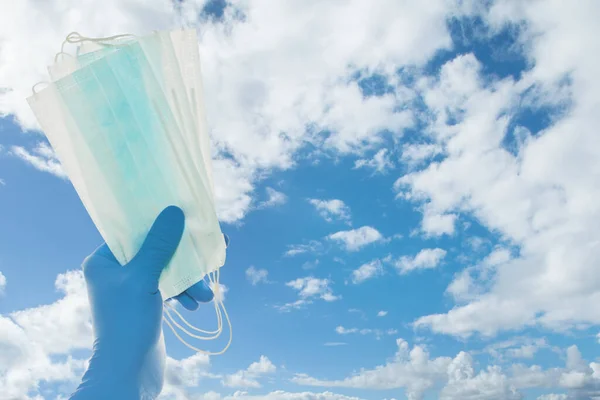 Hand Doctor Gloves Holding Protective Mask Sky Clouds Background Safety — Stock Photo, Image