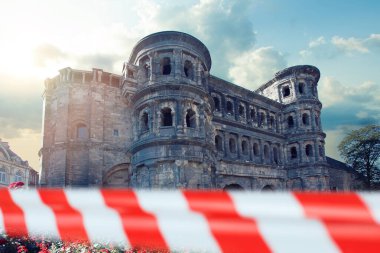 Porta Nigra in Trier with warning tape, Germany clipart