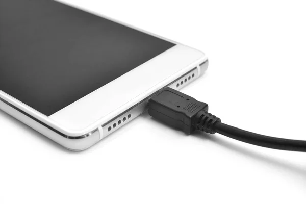 A smartphone charging — Stock Photo, Image