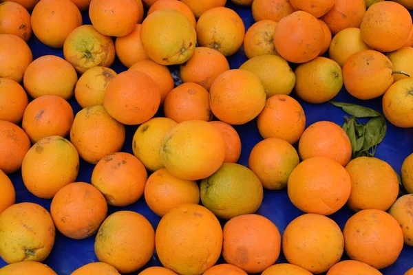 Appelsiinihedelmien tausta — kuvapankkivalokuva