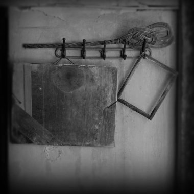 hanger with stained mirror and empty picture frame