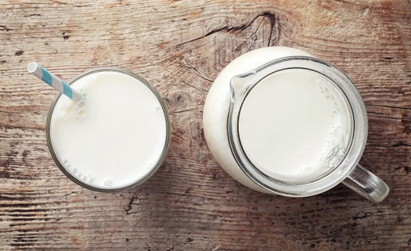 Glass and jug of milk — Stock Photo, Image