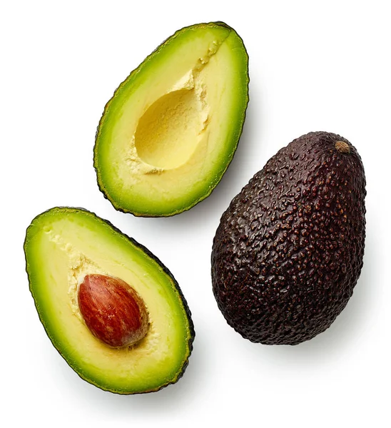 Geheel en gesneden in halve avocado — Stockfoto