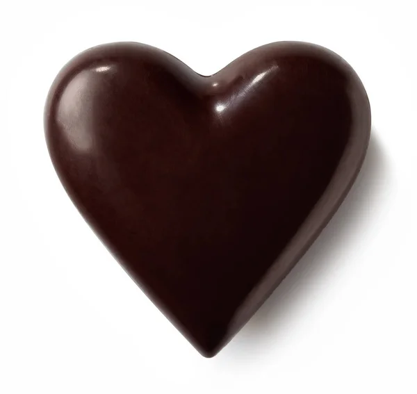 Dark chocolate heart on white background — Stock Photo, Image