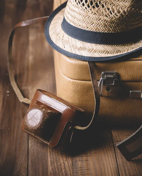 Traveling concept. Vintage camera, bag and hat