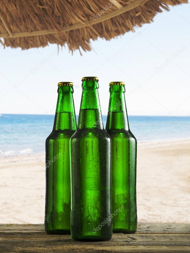 Beer bottles on tropical beach