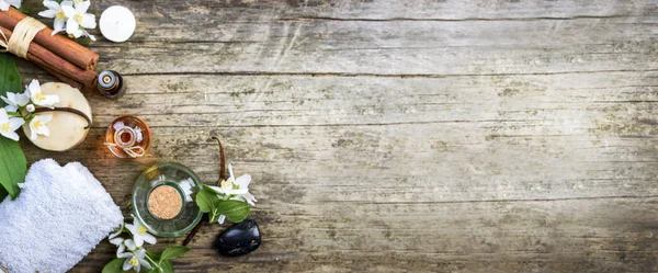 Top view of essential oils with jasmine, cinnamon and vanilla on — Stock Photo, Image