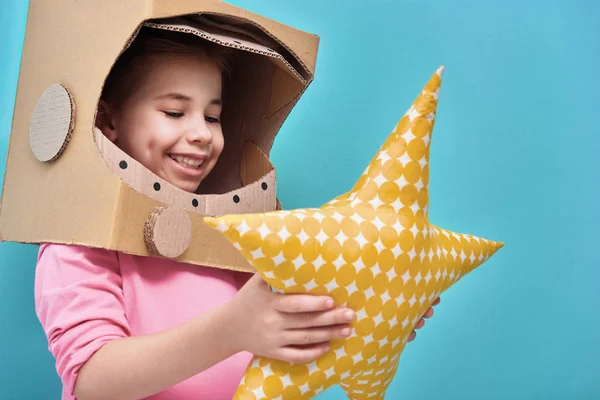 Girl in an astronaut costume — Stock Photo, Image