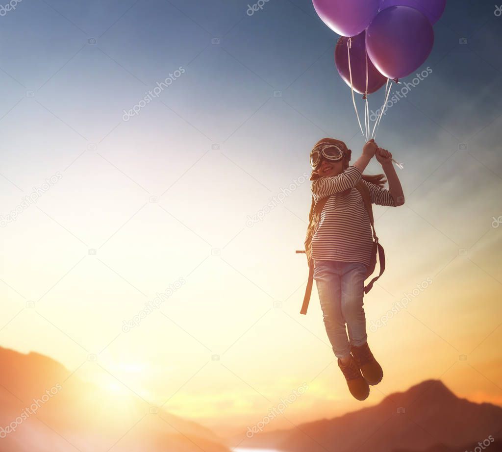 Child flying on balloons
