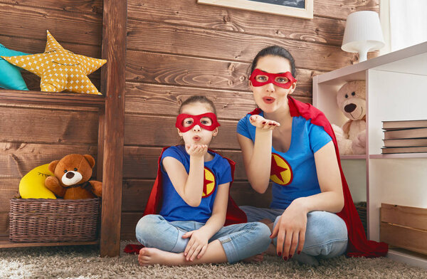 Girl and mom in Superhero costume