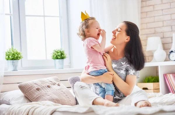 Mother and daughter playing and hugging — Stock Photo, Image