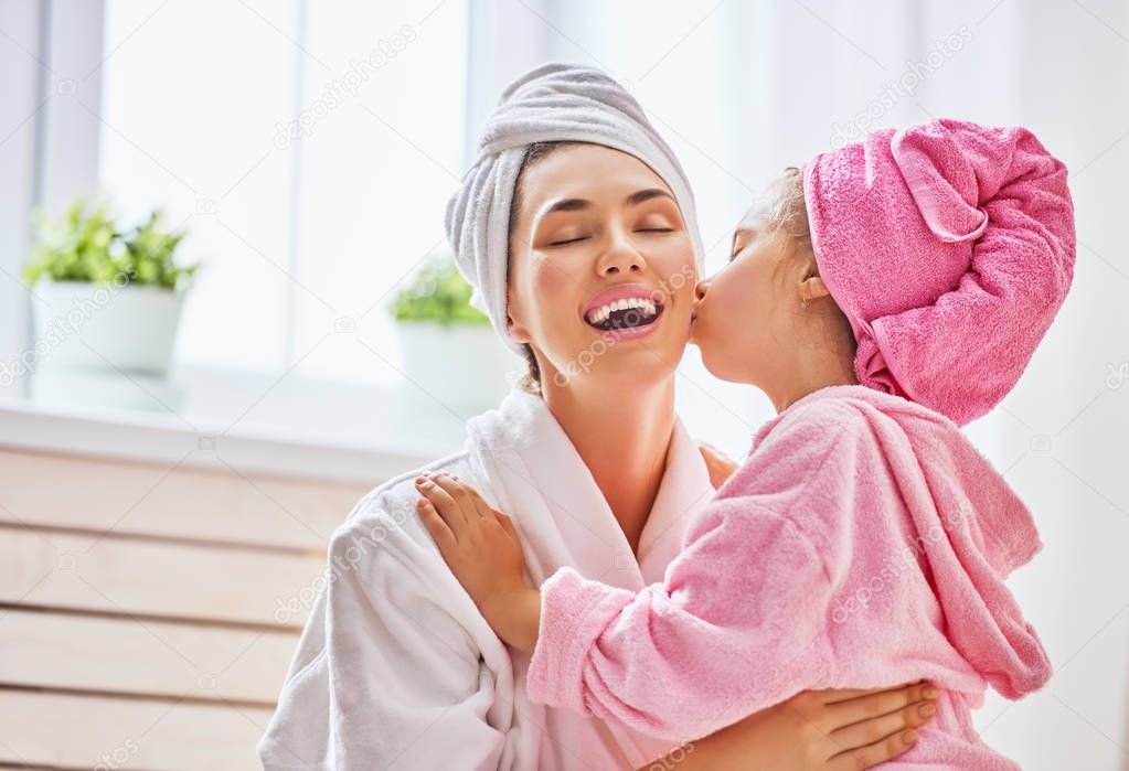 Woman and girl with towels on heads