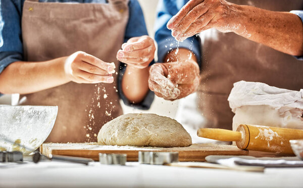 Hands preparing dough