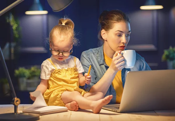 mother with toddler working