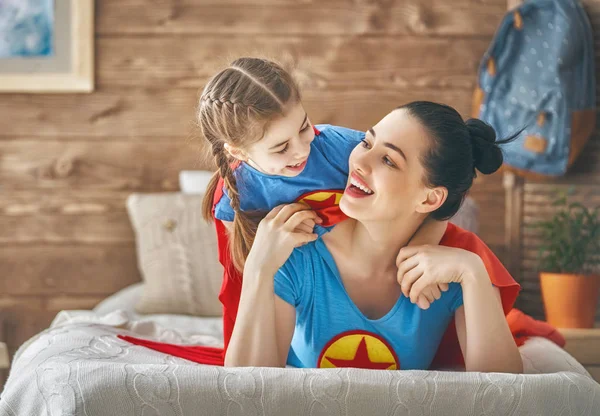 Girl and mom in Superhero costume — Stock Photo, Image