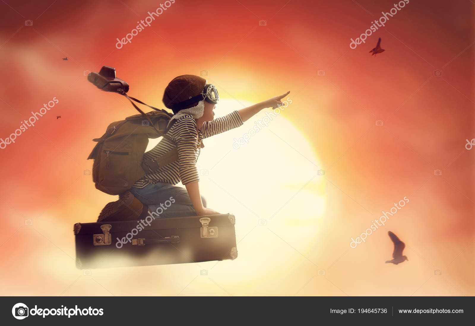 Child flying on a suitcase — Stock Photo © choreograph 194645736