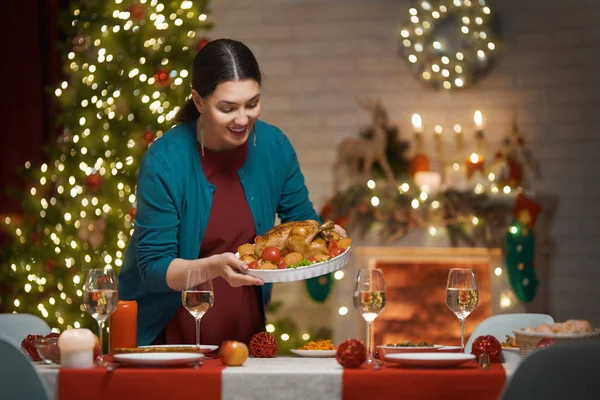 Woman is holding Christmas turkey. — ストック写真