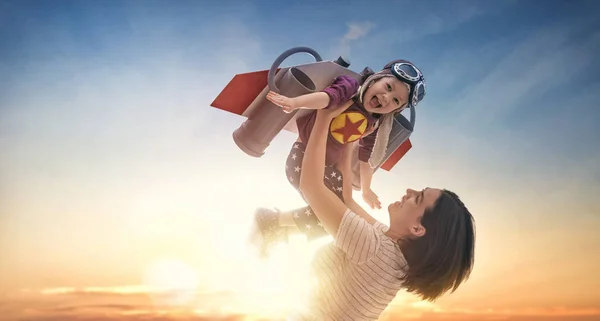 Mother and child in astronaut costume — Stock Photo, Image