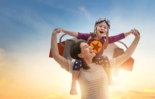 Mother and child in astronaut costume — Stock Photo, Image