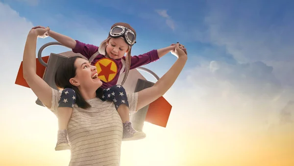 Mother and child in astronaut costume — Stock Photo, Image