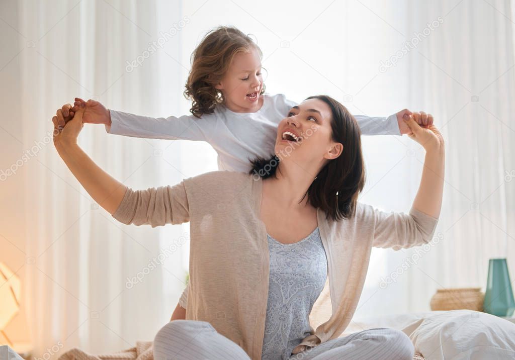 girl and her mother enjoy sunny morning