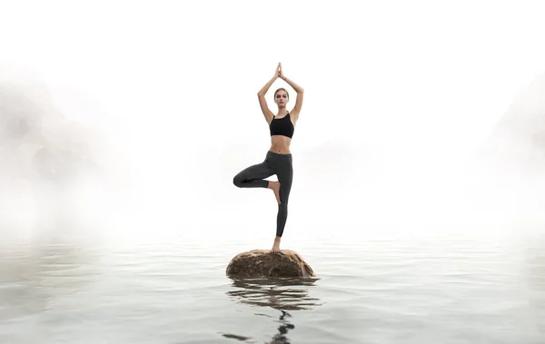 Woman practices yoga — Stock Photo, Image