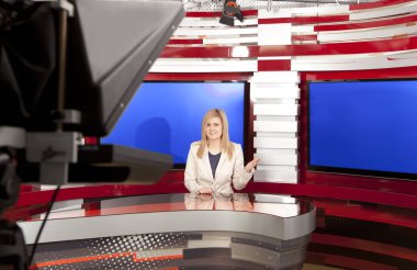 A television anchorwoman at studio during live broadcasting clipart