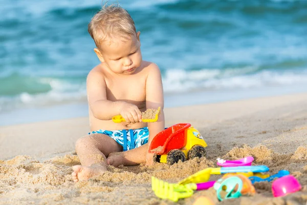 Cute boy playing toys — Stock Photo, Image