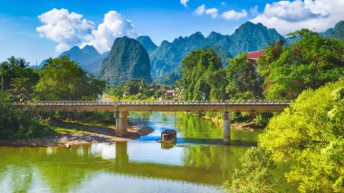 Amazing landscape of river among mountains. Laos. Panorama clipart