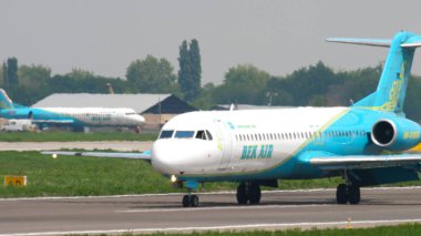 Bek Air Fokker F100 taxiing clipart