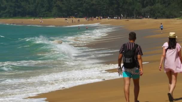 The tourist on sand beach at Mai Khao beach near Phuket airport — Stock Video